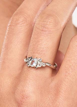 A woman's hand with a Clogau Kensington Fife Tiara Ring 3SKFDR on it.