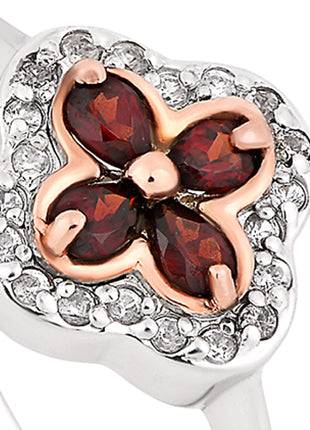 A Clogau Tudor Court Garnet Ring 3STDCRR with red and white diamonds.