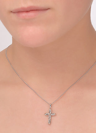 A woman wearing a necklace with a Clogau Tree of Life® Cross Pendant 3STLC3.