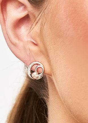 A close up of a woman's ear with a CLOGAU Tree of Life Vine Stud Earrings. 3STOLCDE.