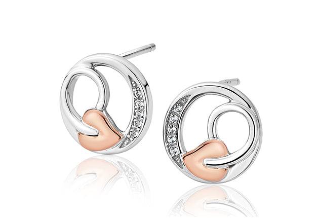 A pair of CLOGAU Tree of Life Vine stud earrings with diamonds.
