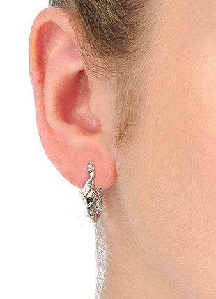 A woman's ear with a Clogau Tree of Life® Earrings 3STOLHHE.