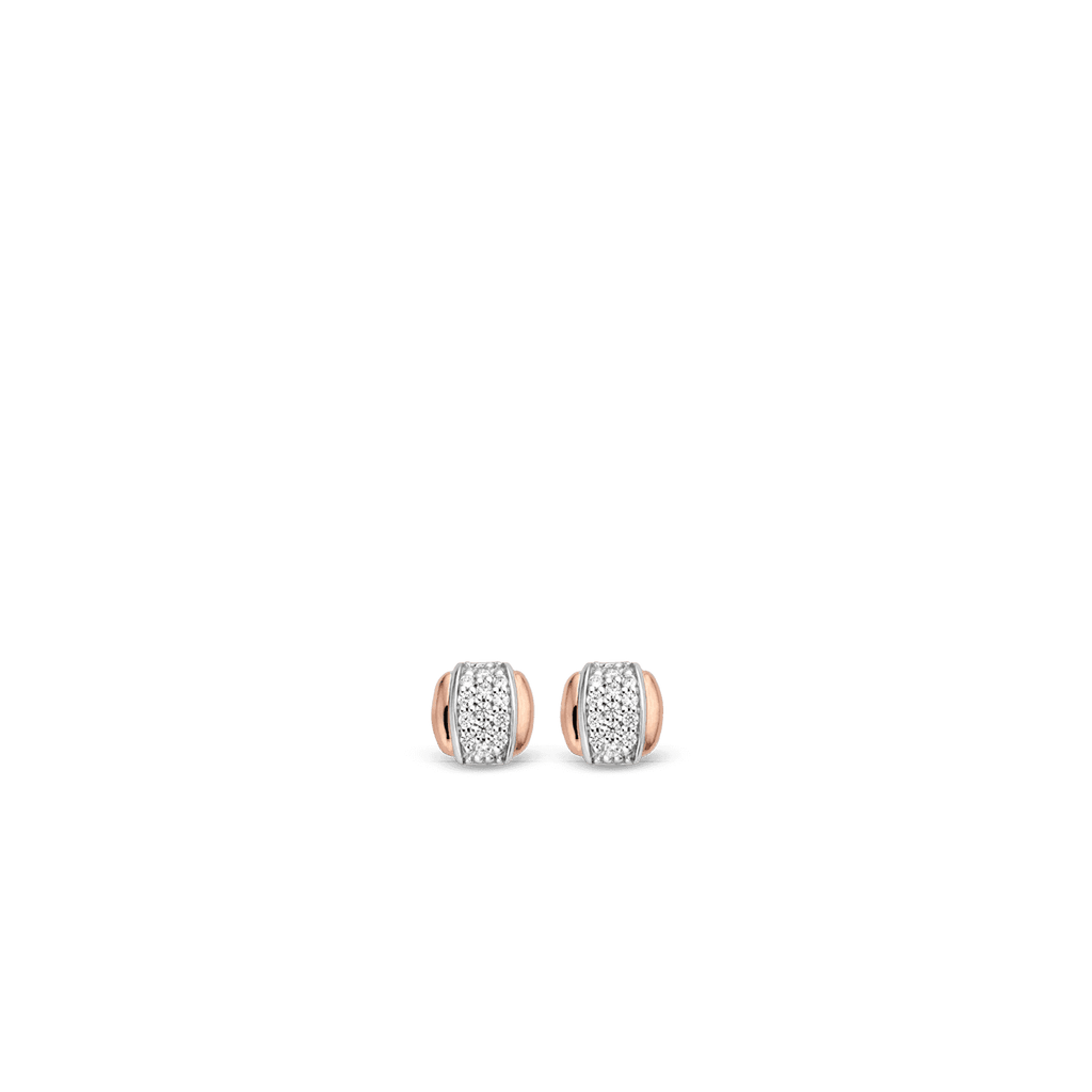 A pair of TI SENTO – STUD EARRINGS 7799ZR with diamonds on a black background.