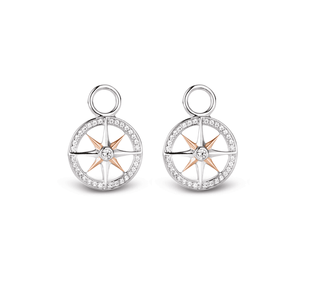 A pair of TI SENTO Milano Ear Charms compass earrings.