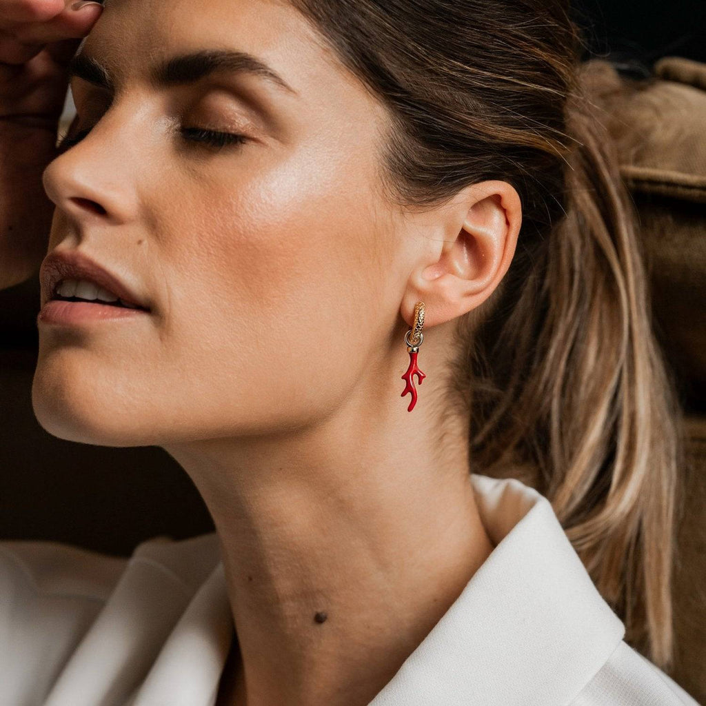A woman wearing a white shirt and TI SENTO Milano Ear Charms 9214CR earrings.