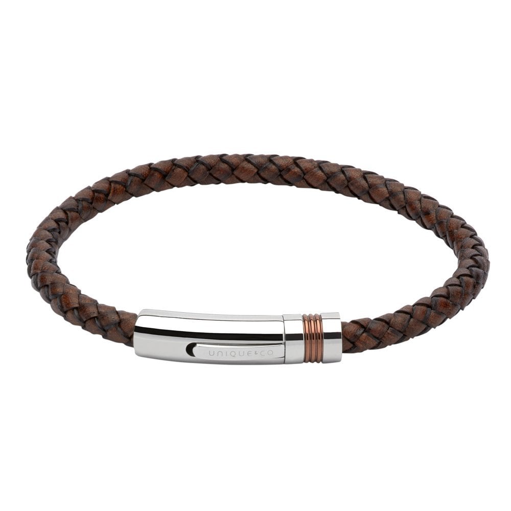 A MEN'S LEATHER BRACELET STEEL WITH ROSE GOLD ELEMENTS BY UNIQUE & CO with a silver clasp.