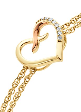 A Clogau Kiss Diamond Heart Bracelet CGKDBR bracelet with yellow gold and diamonds.