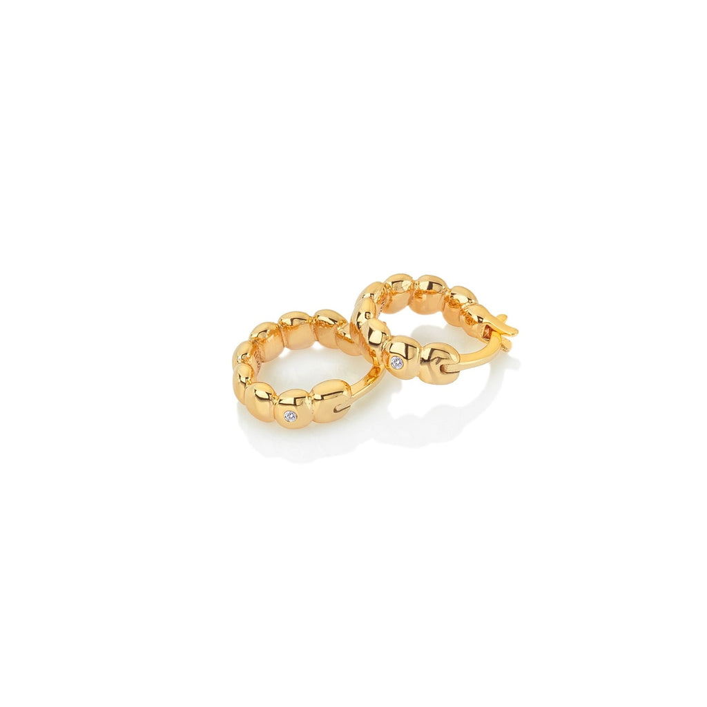 A pair of Hot Diamonds X Jac Jossa Beach Earrings on a white background.
