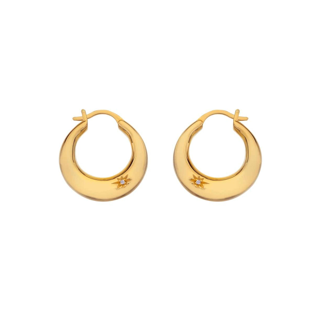 A pair of Hot Diamonds X Jac Jossa Soul Statement Earrings with yellow gold hoop earrings.