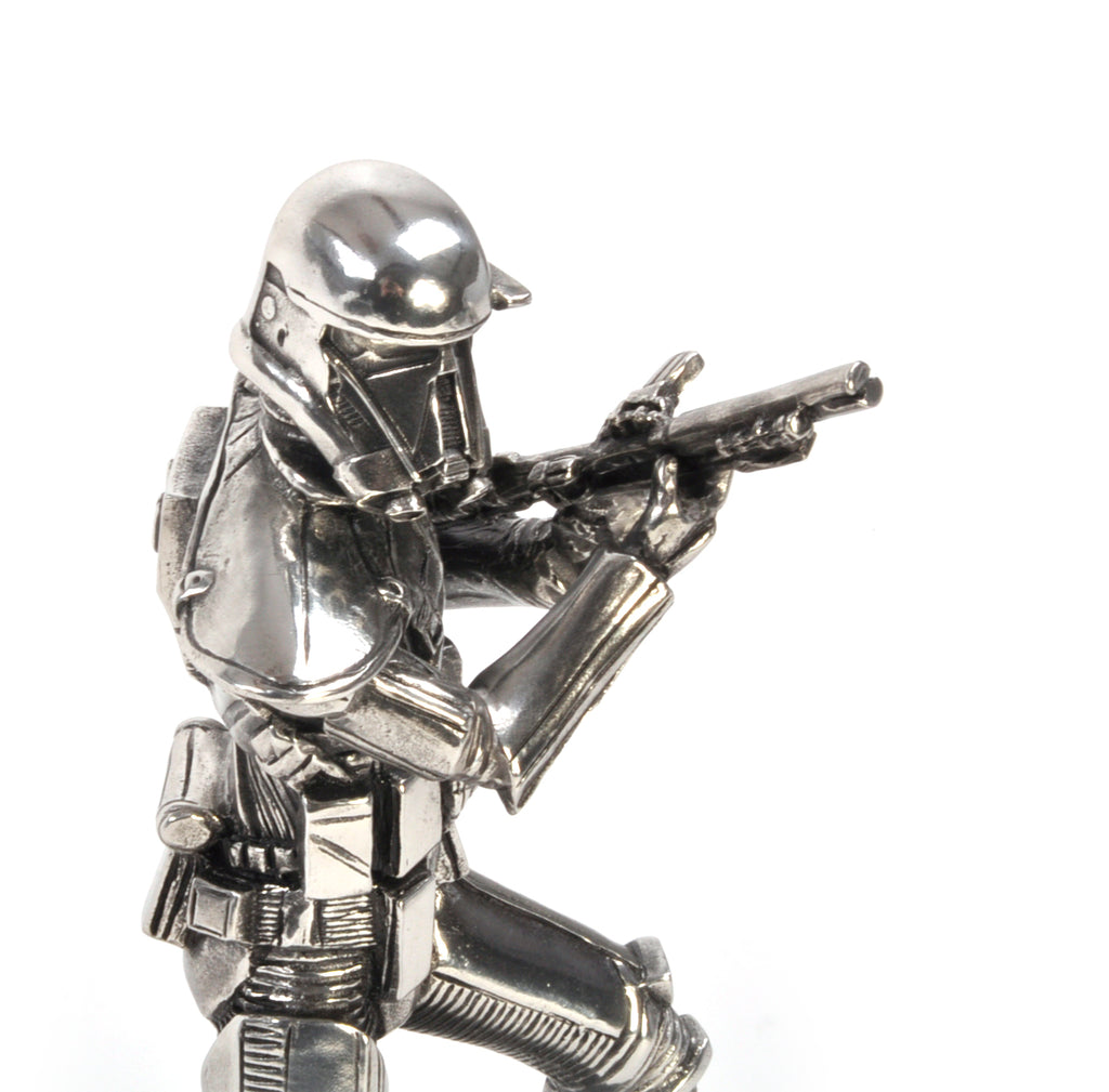 A Death Trooper Star Wars Figurine 017918R holding a gun.