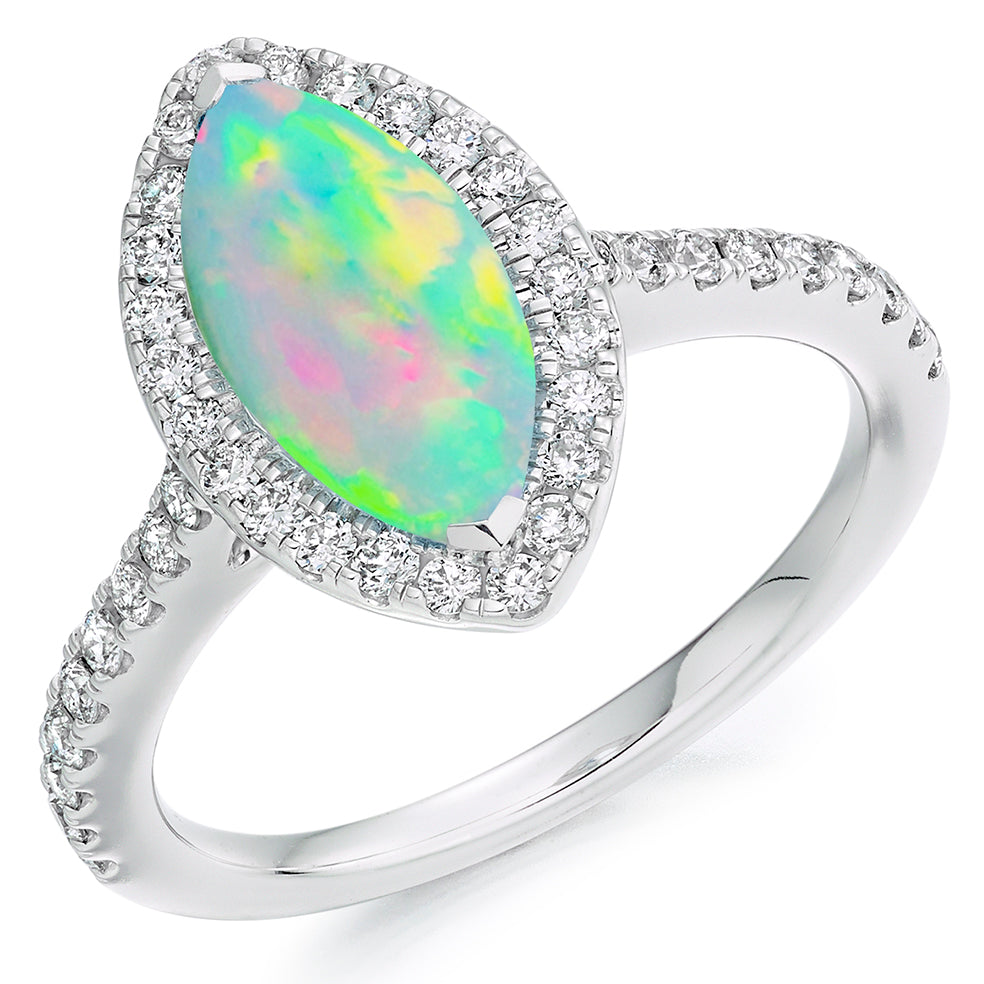 An Opal & Diamond Cluster Ring with a pear shaped opal.