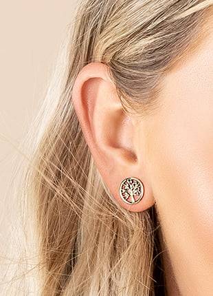 A woman's ear with a Tree of Life Stud Earrings GTOL0009.