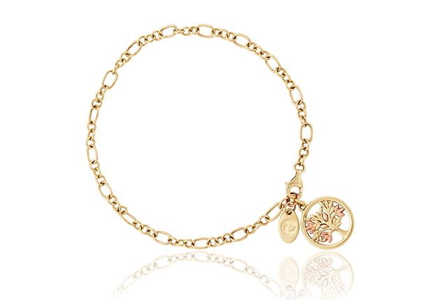 A Clogau Gold Tree of Life Bracelet GTOL0017 with a charm and a tree of life charm.