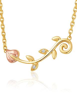 A Vines of Life Diamond Necklace with a rose and diamonds on it.