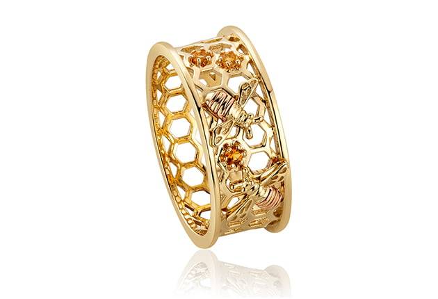 A Clogau Honey Bee Honeycomb Ring HNBWR with an intricate design.