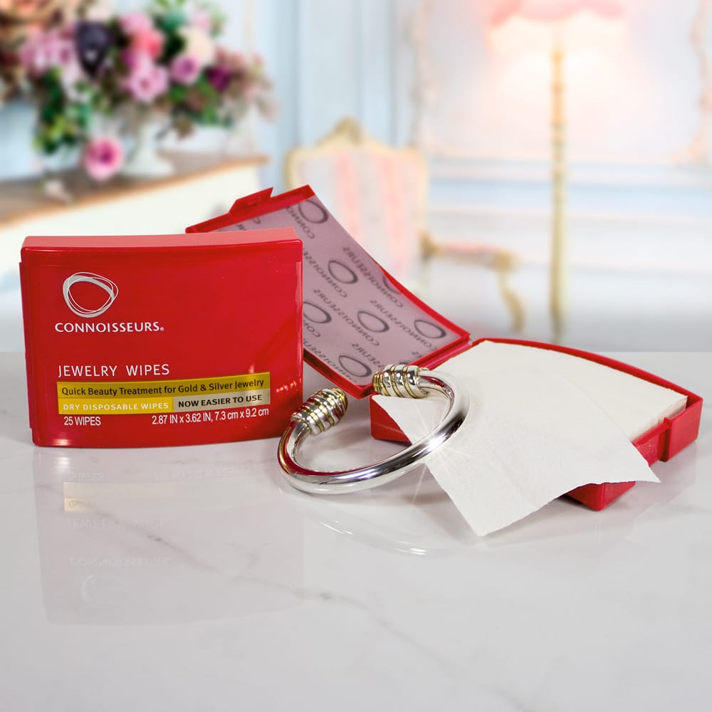 A red box with a bangle and a tissue in it was replaced with Connoisseurs Jewellery Wipes.