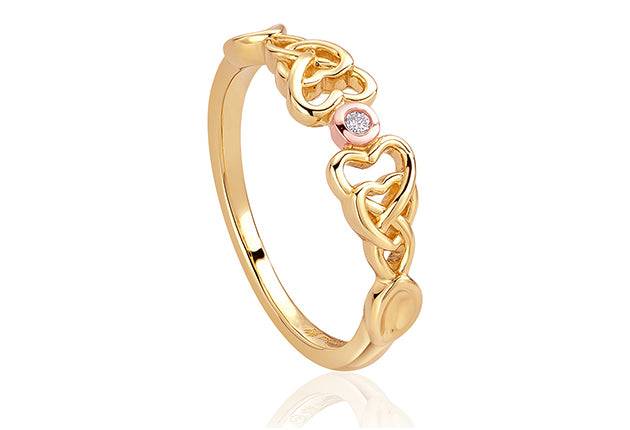 A Clogau Lovespoon Ring LSDR1 with a diamond and a pink ring.