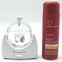A bottle of CONNOISSEURS LASONIC® JEWELLERY BATH and a bottle of lotion next to each other.