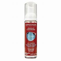 A bottle of CONNOISSEURS JEWELLERY CLEANSING FOAM with a red bottle on a white background.