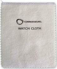 A white cloth with the word CONNOISSEURS WATCH POLISHING CLOTH on it.