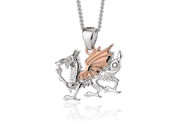 A silver and rose gold Clogau Welsh Dragon® pendant on a chain.