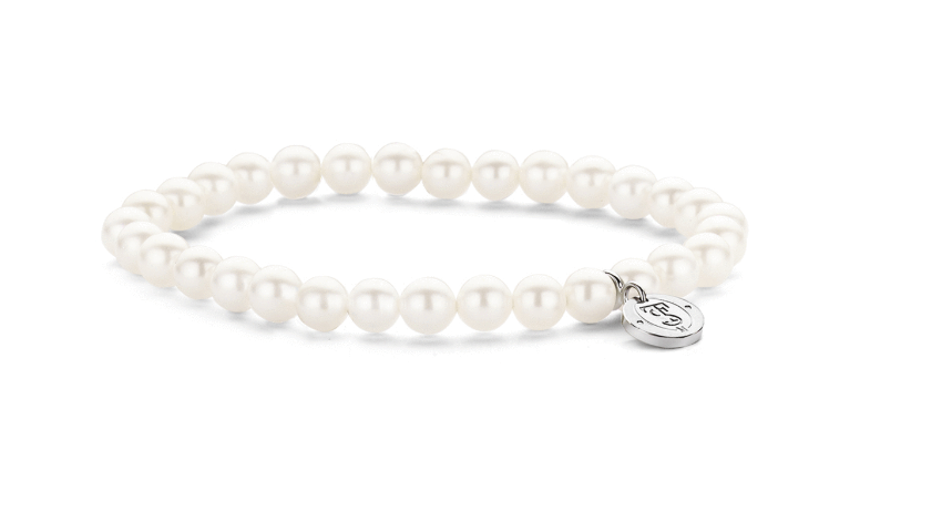 A Pearl Bracelet with a charm on it.