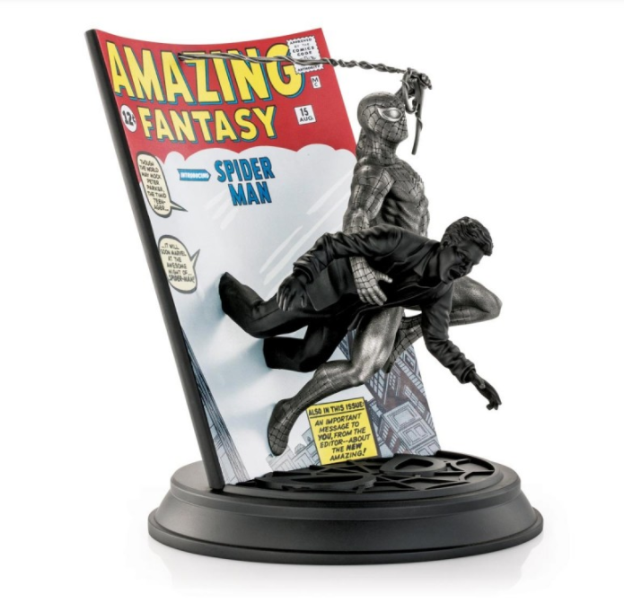 A statue of Limited Edition Spider-Man Amazing Fantasy #15 0179017 with a magazine on top.