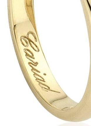A Clogau Gold Welsh Wedding Ring. 3mm with the words 'love' engraved on it.