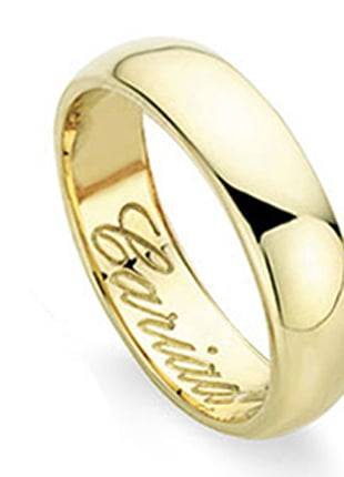 A Clogau Gold Welsh Wedding Ring. 5mm with the words 'love' engraved on it.
