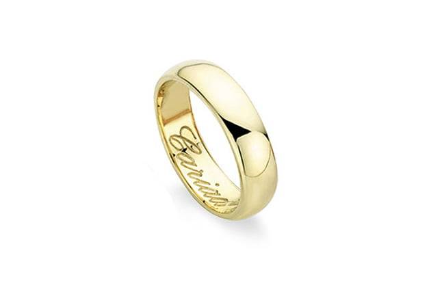 A Clogau Gold Welsh Wedding Ring. 5mm with the word 'love' engraved on it.