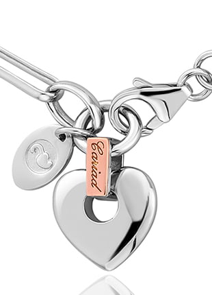 A Clogau Cariad Heart Bracelet with a heart charm on it. XX3SCBR6