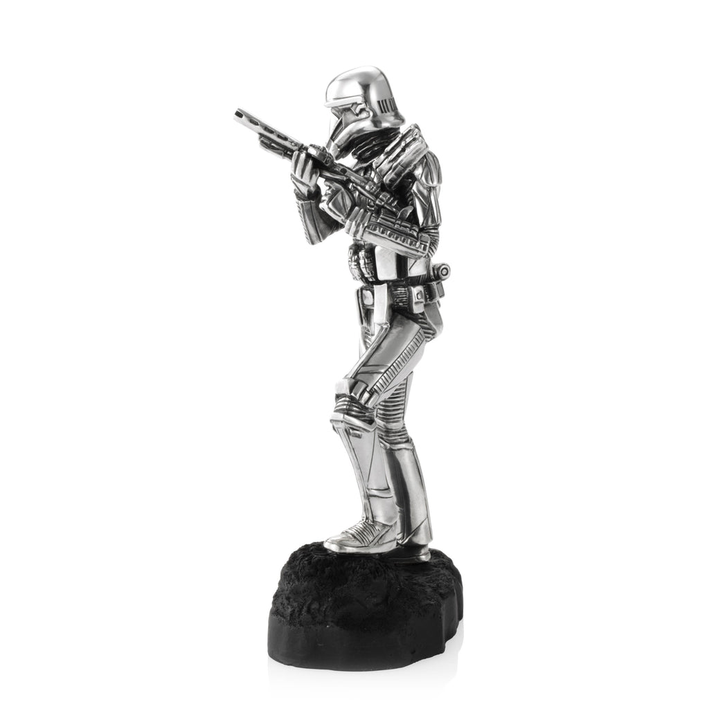 A Death Trooper Star Wars Figurine 017918R in a garment holding a gun.