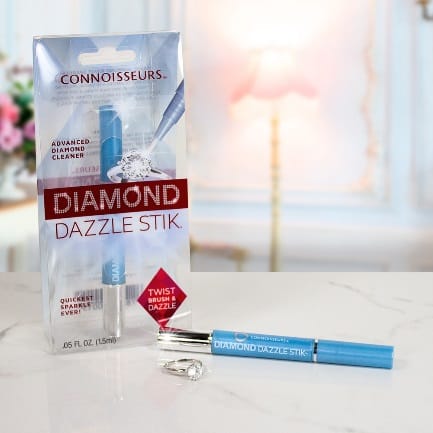 CONNOISSEURS DIAMOND DAZZLE STIK® on a table next to a package.