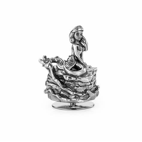 A silver figurine of the Ariel Music Carousel 016305R sitting on a rock.
