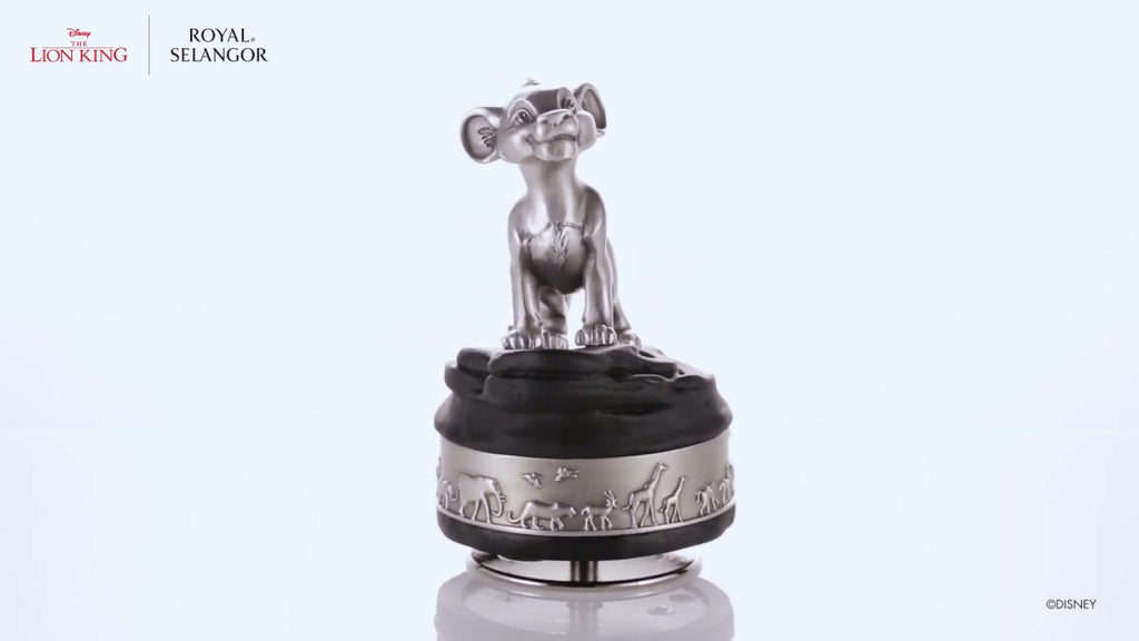 A black and silver Simba Music Carousel 016312 figurine of a lion on top of a white background.